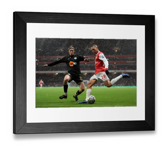 Framed Print : Kieran Gibbs (Arsenal) Ronnie Stam (Wigan). Arsenal 2: 0 Wigan Athletic