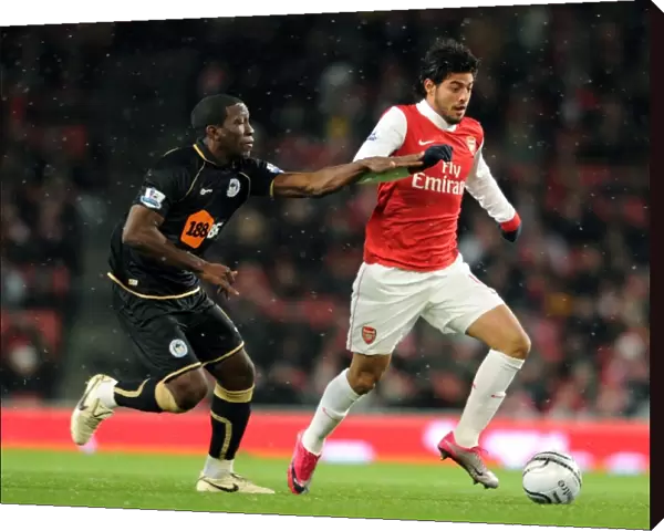 Carlos Vela (Arsenal) Hendry Thomas (Wigan). Arsenal 2: 0 Wigan Athletic