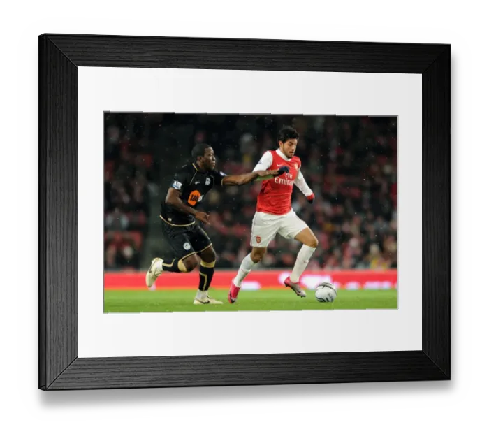 Framed Print : Carlos Vela (Arsenal) Hendry Thomas (Wigan). Arsenal 2: 0 Wigan Athletic