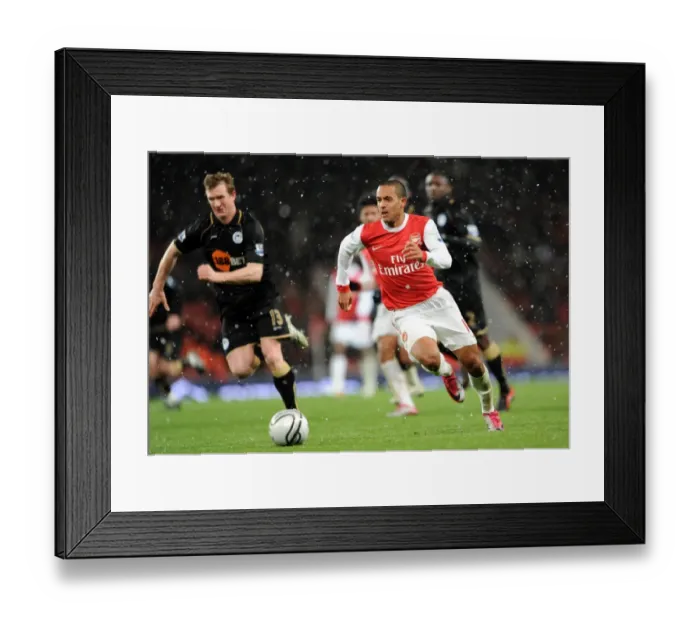 Framed Print : Theo Walcott (Arsenal) Steven Caldwell (Wigan). Arsenal 2: 0 Wigan Athletic Framed Print : Theo Walcott (Arsenal) Steven Caldwell (Wigan). Arsenal 2: 0 Wigan Athletic