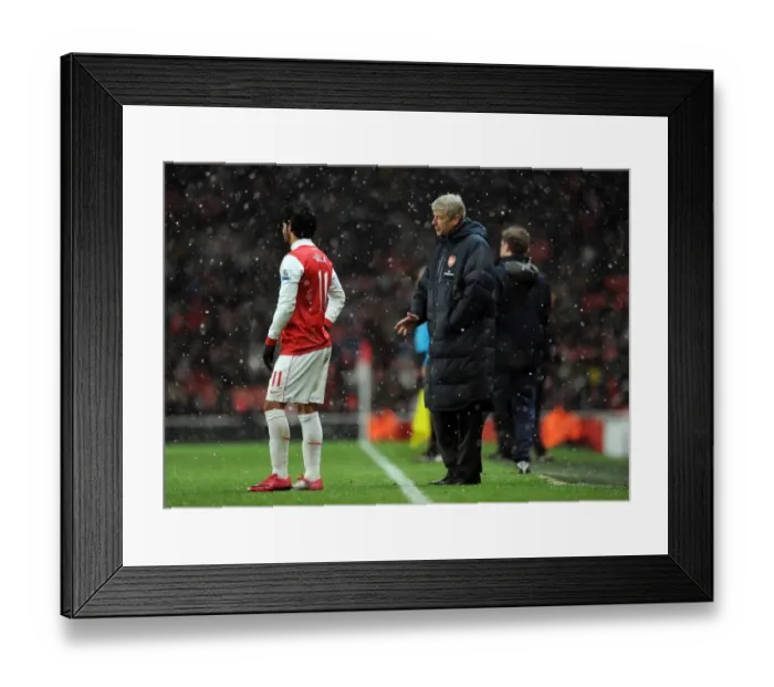 Framed Print : Arsene Wenger the Arsenal Manager talks to Carlos Vela (Arsenal). Arsenal 2