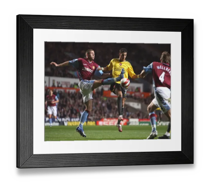 Framed Print : Aliadiere and Cahill Clash: Arsenal's 1-0 Victory over Aston Villa, March 2007