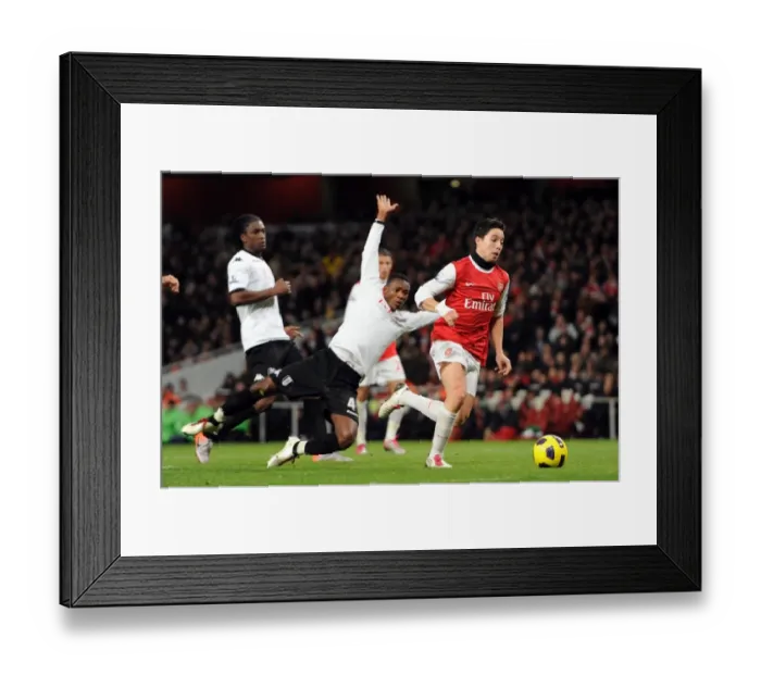 Framed Print : Samir Nasri's Thrilling Goal: Beating Etuhu and Pantsil for Arsenal's 2-1 Lead Against Fulham Framed Print : Samir Nasri's Thrilling Goal: Beating Etuhu and Pantsil for Arsenal's 2-1 Lead Against Fulham