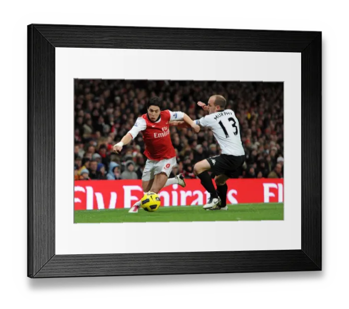Framed Print : Samir Nasri (Arsenal) Danny Murphy (Fulham). Arsenal 2: 1 Fulham. Barclays Premier League Framed Print : Samir Nasri (Arsenal) Danny Murphy (Fulham). Arsenal 2: 1 Fulham. Barclays Premier League