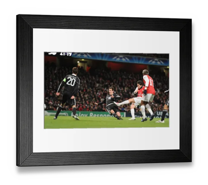 Framed Print : Samir Nasri shoots past Partizan goalkeeper Vladimir Stojkovic to score the 3rd Arsenal goal