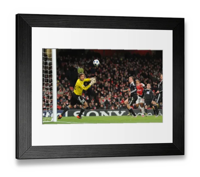 Framed Print : Theo Walcott shoots past Partizan goalkeeper Vladimir Stojkovic to score the 2nd Arsenal goal