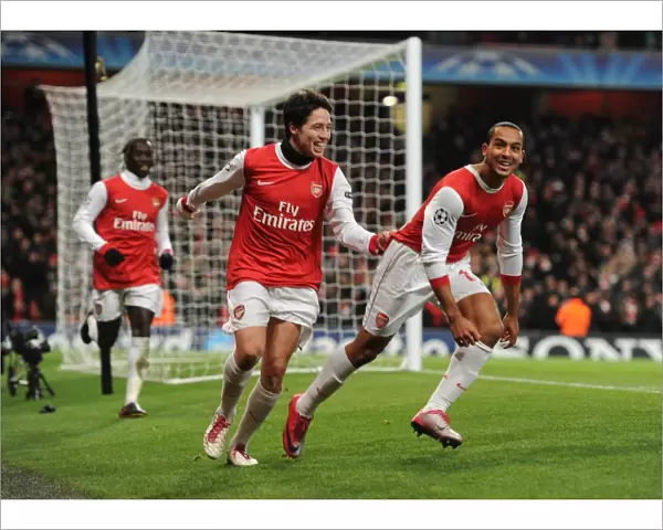 Theo Walcott celebrates scoring the 2nd Arsenal goal with Samir Nasri. Arsenal 3