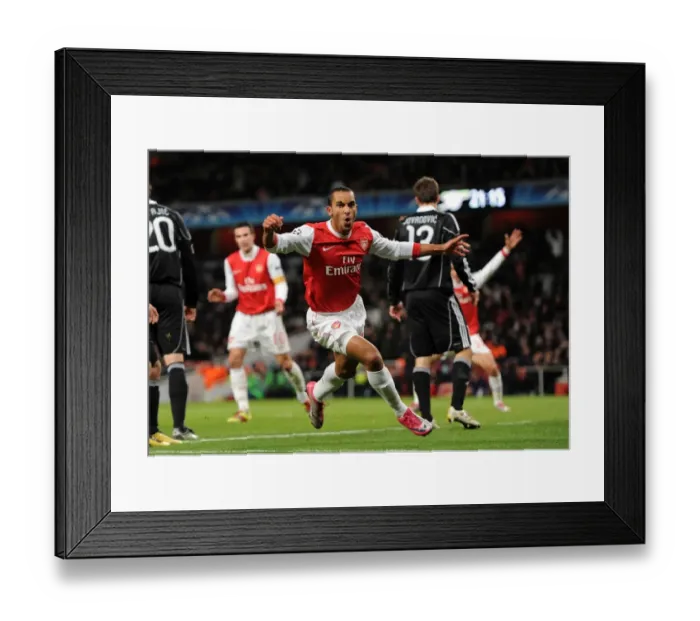 Framed Print : Theo Walcott's Brace: Arsenal's Victory over Partizan Belgrade (3-1) in the Champions League Framed Print : Theo Walcott's Brace: Arsenal's Victory over Partizan Belgrade (3-1) in the Champions League