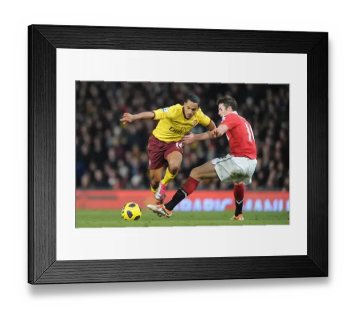 Framed Print : Theo Walcott (Arsenal) Michael Carrick (Man United). Manchester United 1: 0 Arsenal