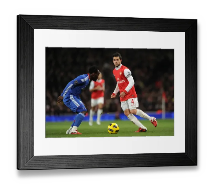 Framed Print : Cesc Fabregas (Arsenal) Michael Essien (Chelsea). Arsenal 3: 1 Chelsea. Barclays Premier League Framed Print : Cesc Fabregas (Arsenal) Michael Essien (Chelsea). Arsenal 3: 1 Chelsea. Barclays Premier League