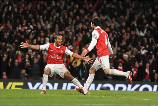 Celebrating Glory: Fabregas and Walcott Rejoice in Arsenal's 3:1 Victory over Chelsea