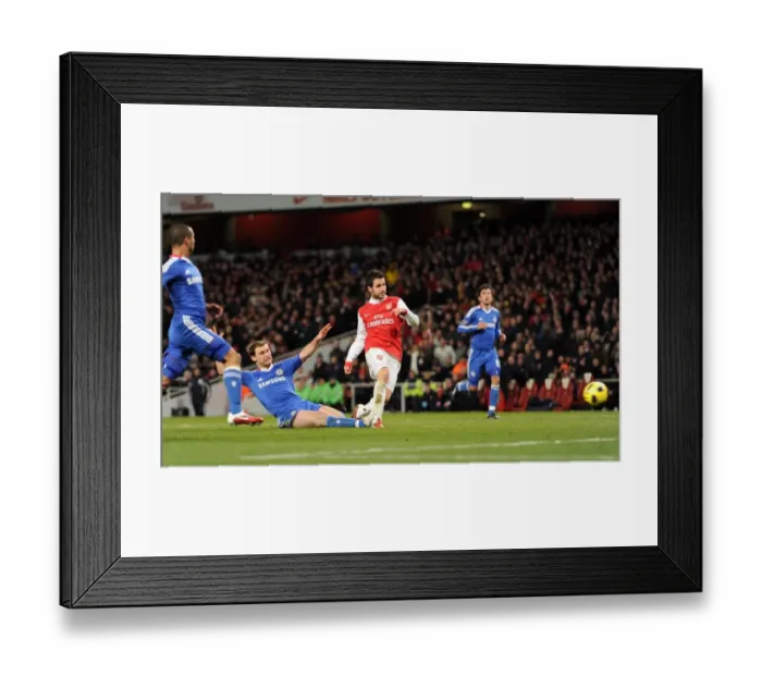 Framed Print : Cesc Fabregas scores Arsenals 2nd goal under pressure from Branislav Invanovic