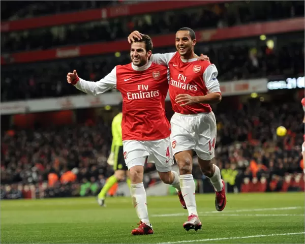 Cesc Fabregas celebrates scoring Arsenals 2nd goal with Theo Walcott