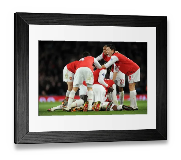 Framed Print : Alex Song celebrates scoring Arsenals 1st goal with his team mates including Samir Nasri