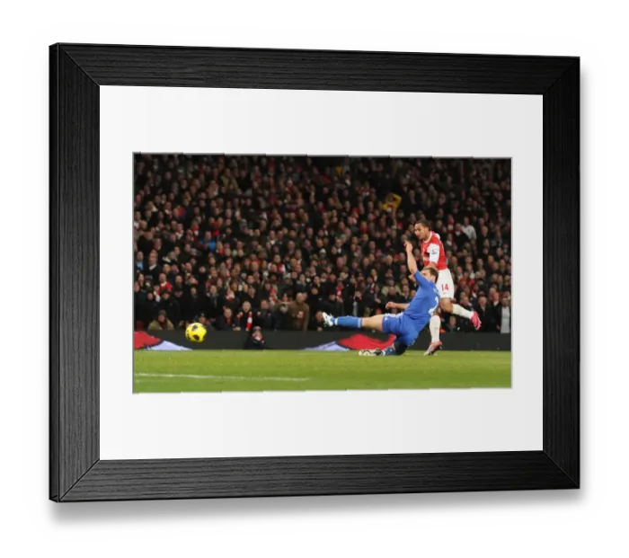 Framed Print : Theo Walcott scores Arsenals 3rd goal under pressure from Branislav Ivanovic