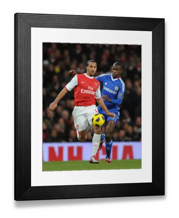 Framed Print : Theo Walcott (Arsenal) Ramires (Chelsea). Arsenal 3: 1 Chelsea. Barclays Premier League Framed Print : Theo Walcott (Arsenal) Ramires (Chelsea). Arsenal 3: 1 Chelsea. Barclays Premier League
