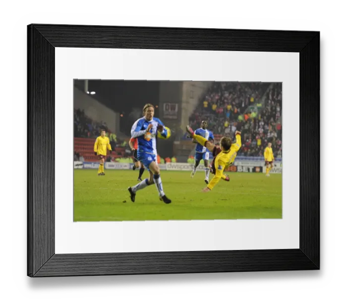 Framed Print : Arshavin Stuns Wigan: First Arsenal Goal with Brilliant Shot Past Ronnie Stam Framed Print : Arshavin Stuns Wigan: First Arsenal Goal with Brilliant Shot Past Ronnie Stam