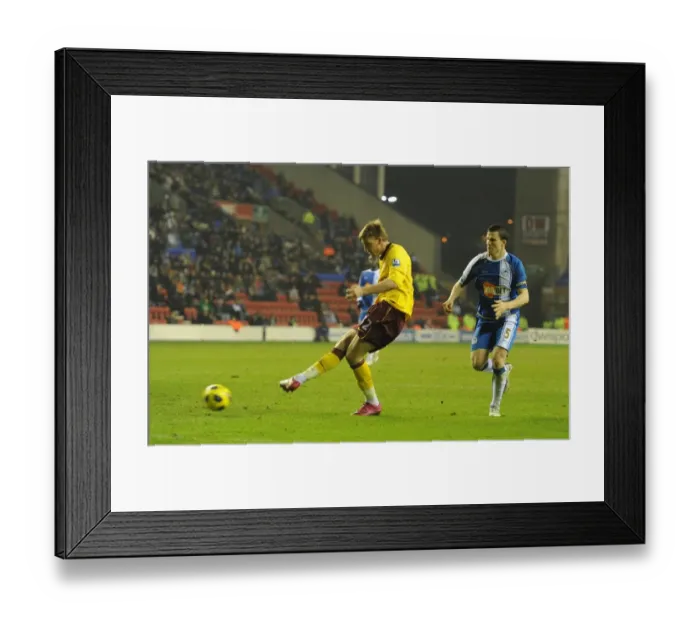 Framed Print : Bendtner Scores Stunner Past Al Habsi: 2-2 Arsenal at Wigan