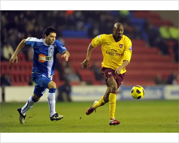 Abou Diaby (Arsenal) Antonlin Alcaraz (Wigan). Wigan Athletic 2: 2 Arsenal