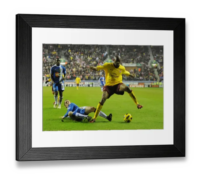 Framed Print : Abou Diaby (Arsenal) Ronnie Stam (Wigan). Wigan Athletic 2: 2 Arsenal, DW Stadium Framed Print : Abou Diaby (Arsenal) Ronnie Stam (Wigan). Wigan Athletic 2: 2 Arsenal, DW Stadium