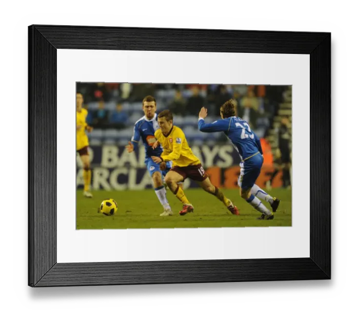 Framed Print : Jack Wilshere (Arsenal) Ronnie Stam (Wigan). Wigan Athletic 2: 2 Arsenal Framed Print : Jack Wilshere (Arsenal) Ronnie Stam (Wigan). Wigan Athletic 2: 2 Arsenal