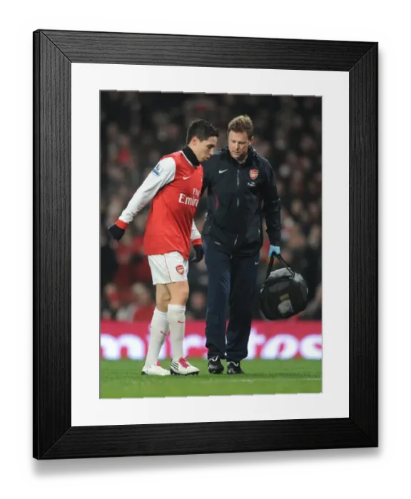 Framed Print : Arsenal physio Colin Lewin treats Samir Nasri. Arsenal 0: 0 Manchester City Framed Print : Arsenal physio Colin Lewin treats Samir Nasri. Arsenal 0: 0 Manchester City