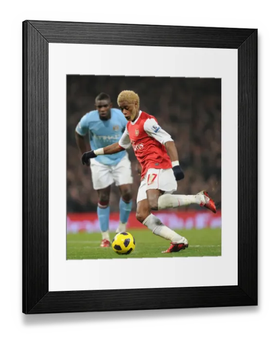 Framed Print : Arsenal's Alex Song Clashes with Manchester City in Intense Premier League Rivalry Framed Print : Arsenal's Alex Song Clashes with Manchester City in Intense Premier League Rivalry