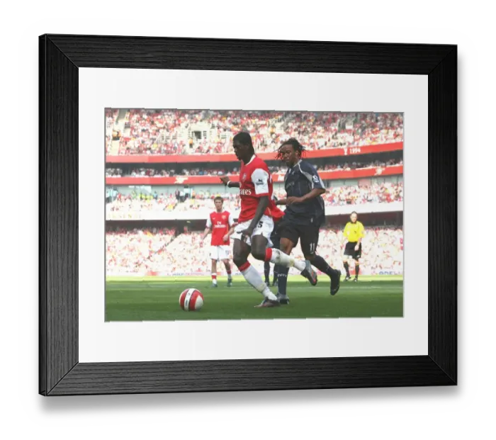 Framed Print : Adebayor's Double: Arsenal Edge Past Bolton 2-1 in FA Premiership Thriller