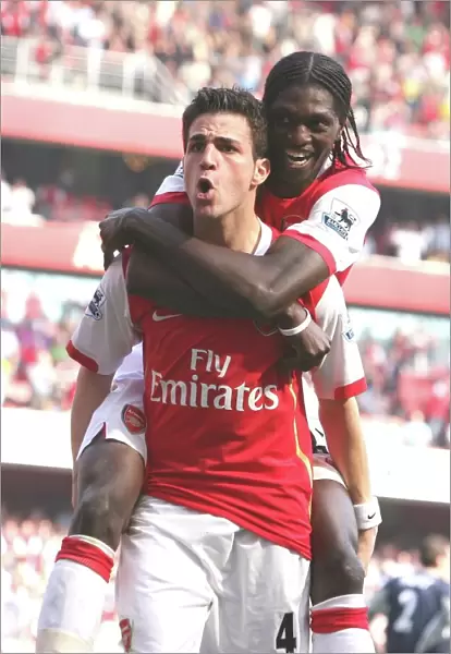 Fabregas and Adebayor: Arsenal's Unstoppable Duo Celebrate Goal Against Bolton Wanderers