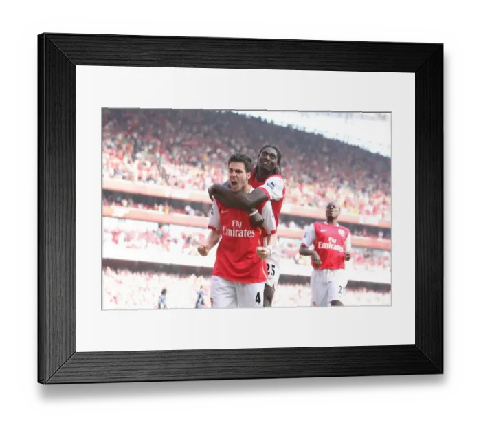 Framed Print : Celebrating Glory: Fabregas and Adebayor Rejoice After Arsenal's Second Goal vs. Bolton Wanderers (2007)
