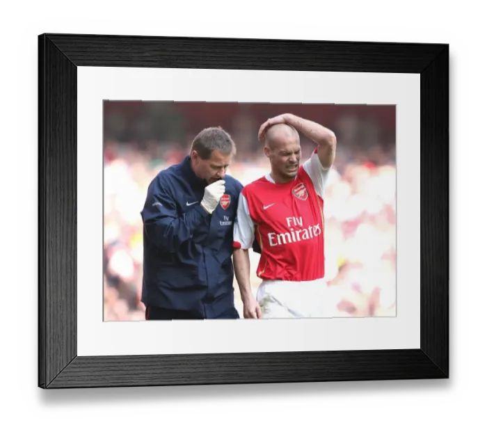 Framed Print : Arsenal's Gary Lewin Tends to Freddie Ljungberg: 2:1 Win Against Bolton Wanderers, 2007 Framed Print : Arsenal's Gary Lewin Tends to Freddie Ljungberg: 2:1 Win Against Bolton Wanderers, 2007