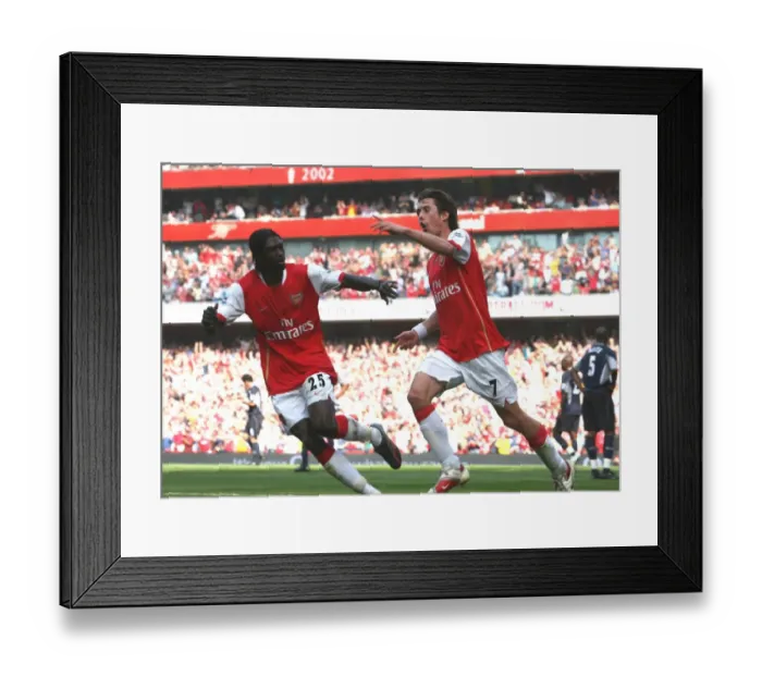 Framed Print : Rosicky and Adebayor: Unforgettable Moment as Arsenal Secures a 2:1 Victory over Bolton Wanderers