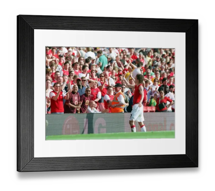 Framed Print : Tomas Rosicky (Arsenal) throws his shirt to the fans after the match Framed Print : Tomas Rosicky (Arsenal) throws his shirt to the fans after the match
