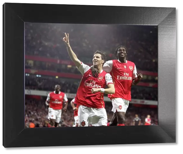 Cesc Fabregas celebrates scoring Arsenals 2nd goal and Emmanuel Adebayor
