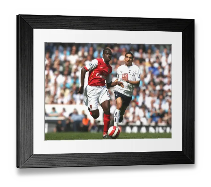 Framed Print : Clash of Rivals: Eboue vs. Lennon in the Intense 2006-07 FA Premiership Rivalry between Tottenham and Arsenal