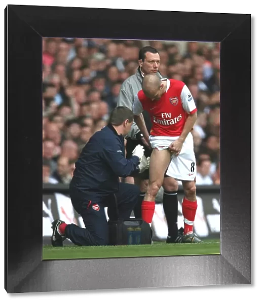 Arsenal's Gary Lewin Tends to Freddie Ljungberg: FA Premiership Clash at White Hart Lane, 2007