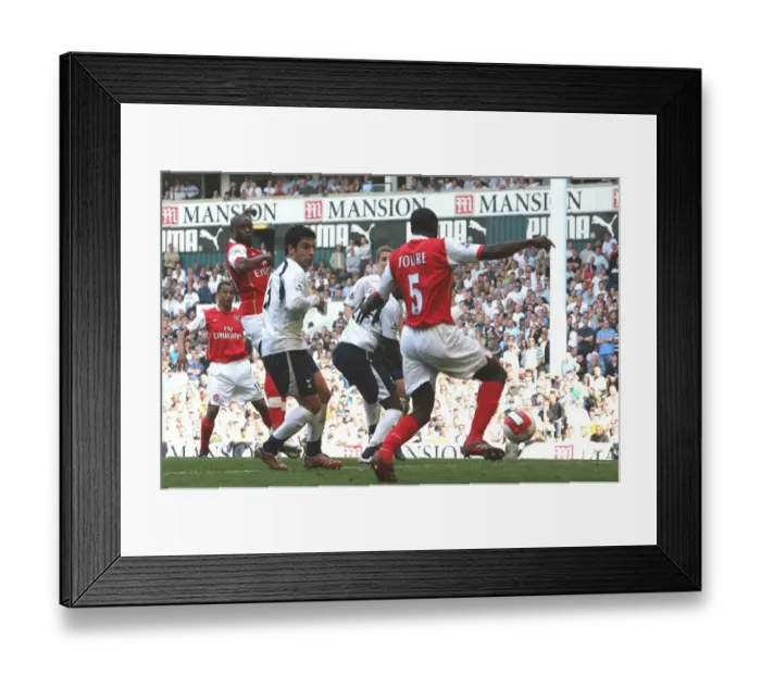 Framed Print : Kolo Toure shoots past Tottenham goalkeeper PAul Robinson to score the 1st Arsenal goal Framed Print : Kolo Toure shoots past Tottenham goalkeeper PAul Robinson to score the 1st Arsenal goal