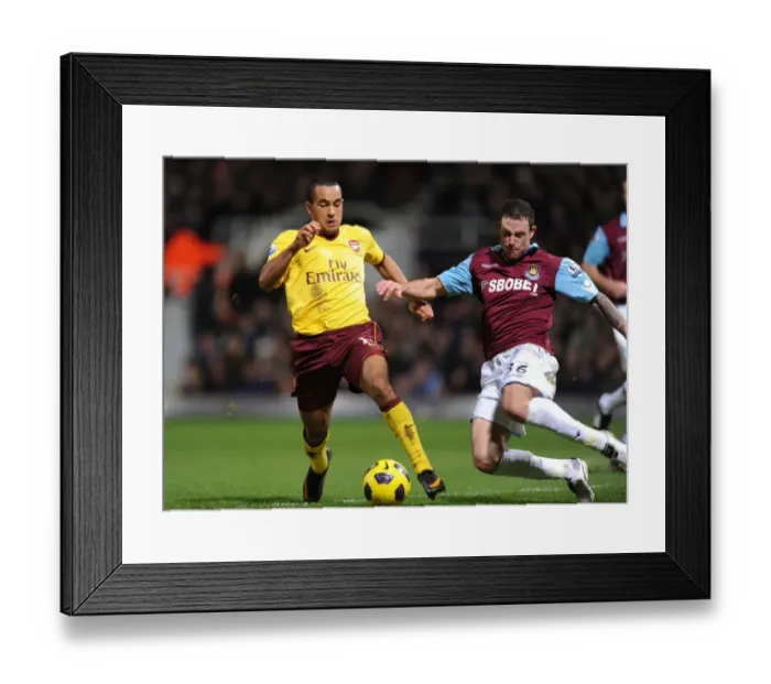 Framed Print : Theo Walcott (Arsenal) is trippede by West Ham defender Wayne Bridge. West Ham United 0 Framed Print : Theo Walcott (Arsenal) is trippede by West Ham defender Wayne Bridge. West Ham United 0