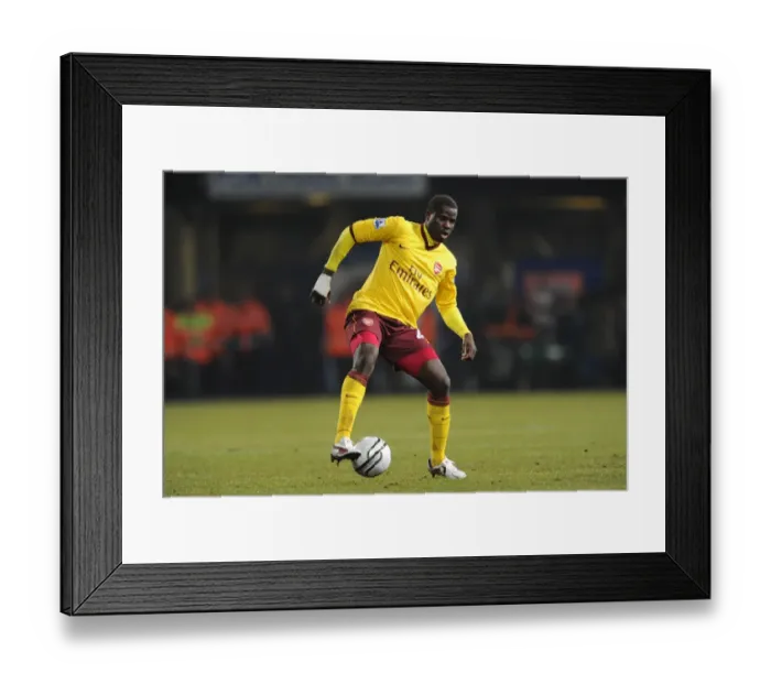 Framed Print : Emmanuel Eboue Leads Arsenal to 1-0 Carling Cup Semi-Final Victory over Ipswich Town