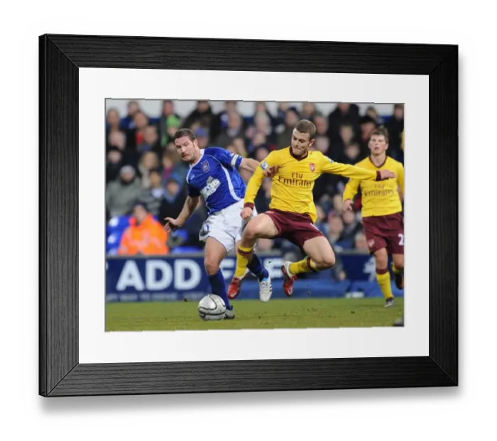 Framed Print : Jack Wilshere (Arsenal) David Norris (Ipswich). Ipswich Town 1: 0 Arsenal