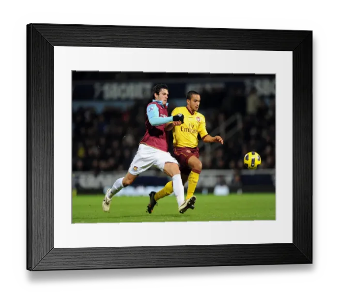 Framed Print : Theo Walcott (Arsenal) James Tomkins (West Ham). West Ham United 0: 3 Arsenal Framed Print : Theo Walcott (Arsenal) James Tomkins (West Ham). West Ham United 0: 3 Arsenal