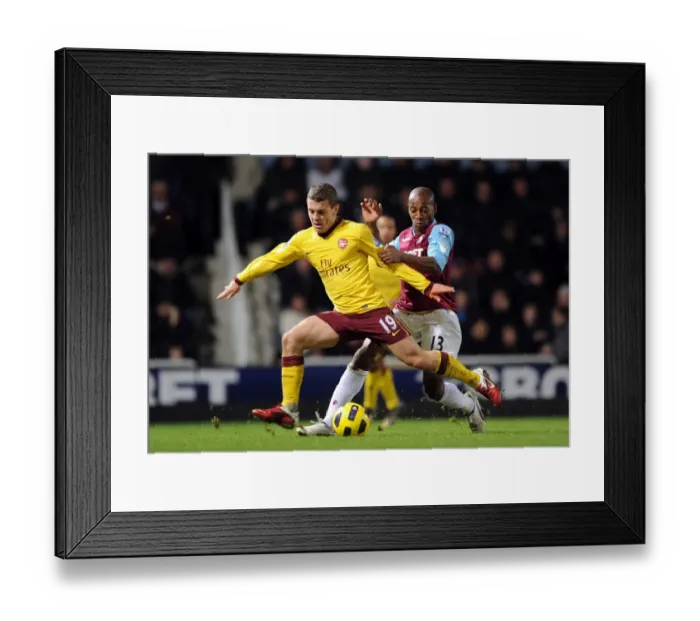 Framed Print : Jack Wilshere (Arsenal) Luis Boa Morte (West Ham). West Ham United 0: 3 Arsenal Framed Print : Jack Wilshere (Arsenal) Luis Boa Morte (West Ham). West Ham United 0: 3 Arsenal