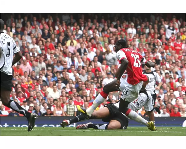 Emmanuel Adebayor shoots past Fulham goalkeeper Antti Niemi to score the 2nd Arsenal goal