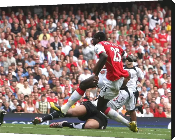 Emmanuel Adebayor shoots past Fulham goalkeeper Antti Niemi to score the 2nd Arsenal goal