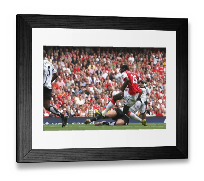 Framed Print : Emmanuel Adebayor shoots past Fulham goalkeeper Antti Niemi to score the 2nd Arsenal goal Framed Print : Emmanuel Adebayor shoots past Fulham goalkeeper Antti Niemi to score the 2nd Arsenal goal