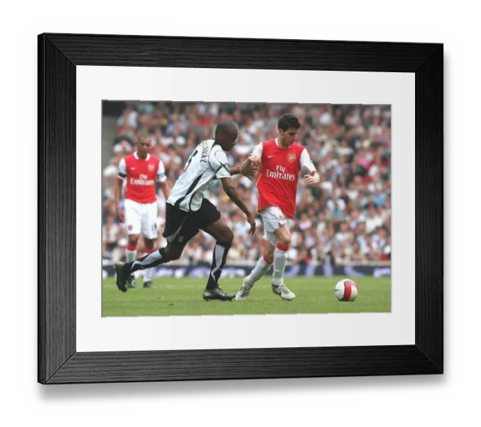 Framed Print : Cesc Fabregas (Arsenal) Philippe Christanval (Fulham) Framed Print : Cesc Fabregas (Arsenal) Philippe Christanval (Fulham)