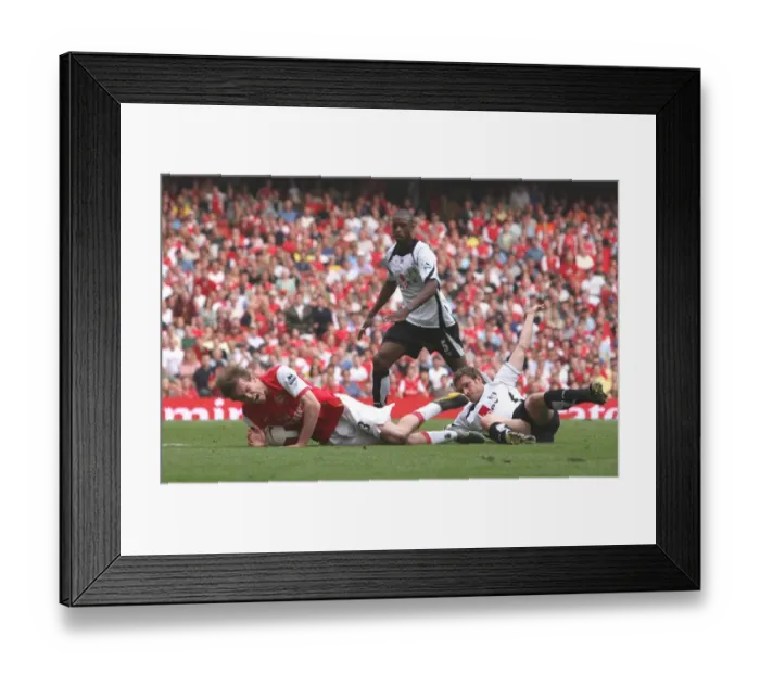 Framed Print : Alex Hleb is brought down for a penalty by Fulham defender Moritz Volz