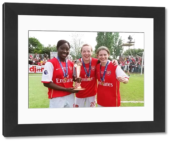 Anita Asante, Gemma Davison and Karen Carney (Arsenal) with the European Trophy