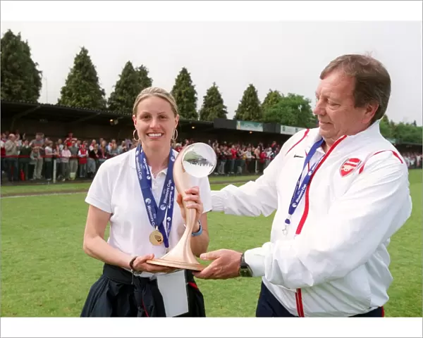 Kelly Smith and Vic Akers the Arsenal Manager with the European Trophy