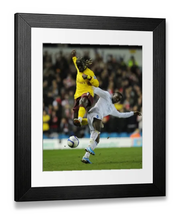 Framed Print : Bacary Sagna (Arsenal) Max Gradel (Leeds). Leeds United 1: 3 Arsenal, FA Cup 3rd Round Replay